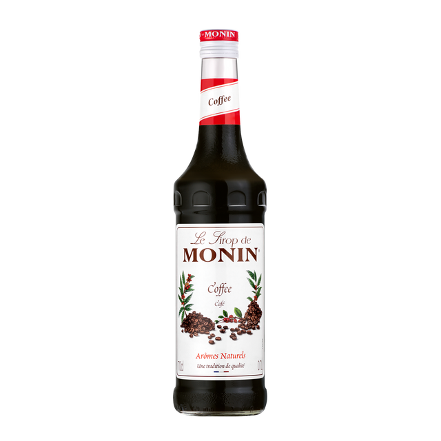 Monin coffe syrup with creamy drink in a tall glass