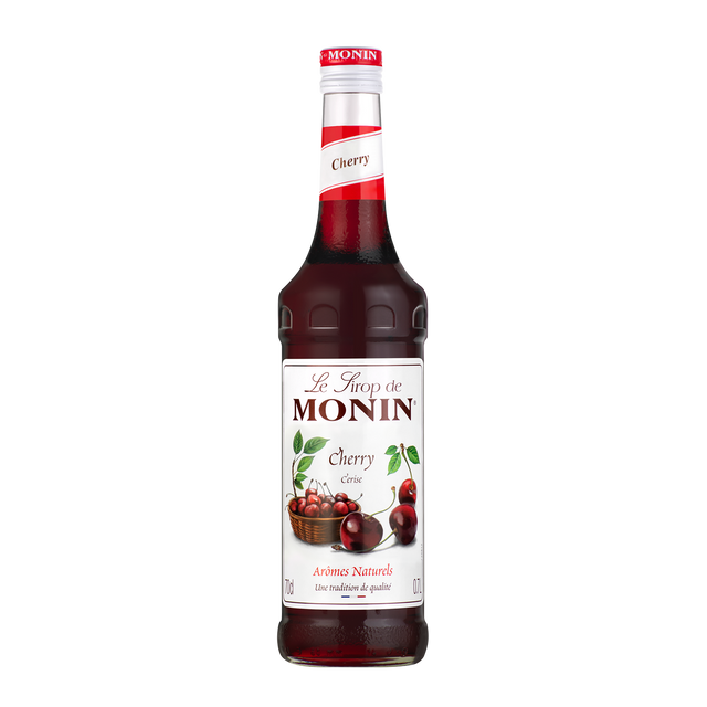 monin cherry syrup bottle and drink in a mason jar