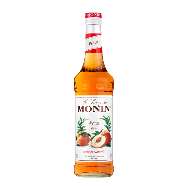 Monin Peach Syrup bottle and mason jar drink